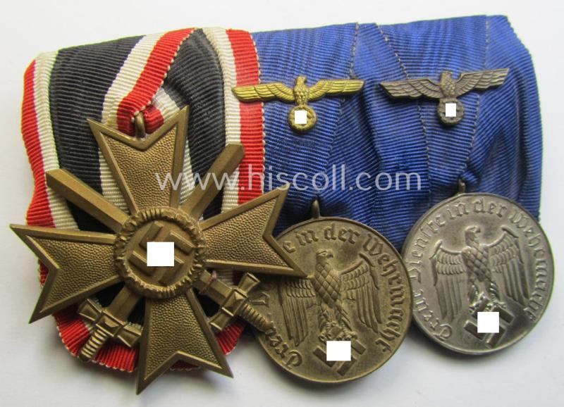Attractive, 3-pieced medal-bar (ie. 'Ordenspange') showing a: 'KvK II. Kl. mit Schwertern' and two: WH (Heeres o. KM) so-called: 'Dienstauszeichnungen für 12 u. 4 Jahre Treue Dienste'