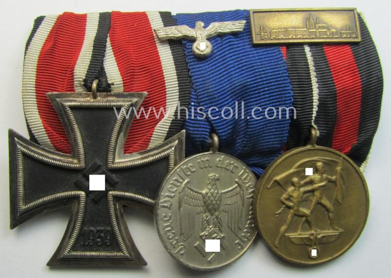 Superb example of a 3-pieced WH (Heeres o. KM etc.) medal-bar (ie.: 'Ordenspange') resp. showing an: 'EKII. Kl.', a: 'WH-DA 4. St.' (with eagle-device) and a: Czech 'Anschluss'-medal (that comes with a firmly attached 'Prager Burg-Spange')