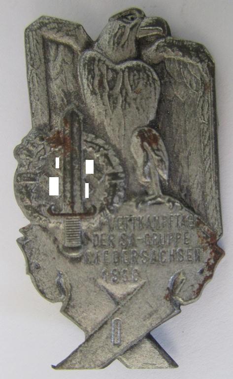 Commemorative - tin-based-, SA- (ie. 'Sturmabteilungen'-) related 'tinnie', being a non-maker-marked- and 'hollow-back' example depicting an eagle-device and SA-sports'-badge and the text: 'SA-Wettkampftage der SA-Gruppe Niedersachsen - 1936'