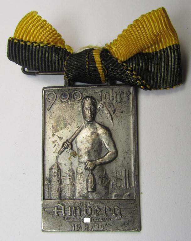 Commemorative, 'Buntmetall'-based 'Veranstaltungsabzeichen' (ie. 'tinnie') being a neatly maker- (ie. 'Carl Poellath'-) marked example that comes mounted on its ribbon showing the text: '900 Jahre Amberg - Bayr. Ostmark - 1934'