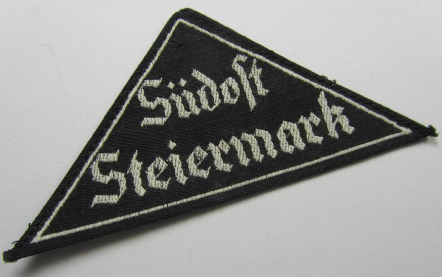 'HJ' ('Hitlerjugend') ie. 'BDM' ('Bund Deutscher Mädel'-) district-triangle (ie. 'Gebietsdreieck') entitled: 'Südost Steiermark' (being a 'virtually mint- ie. unissued' example that still retains most of its paper-based 'RzM'-etiket)