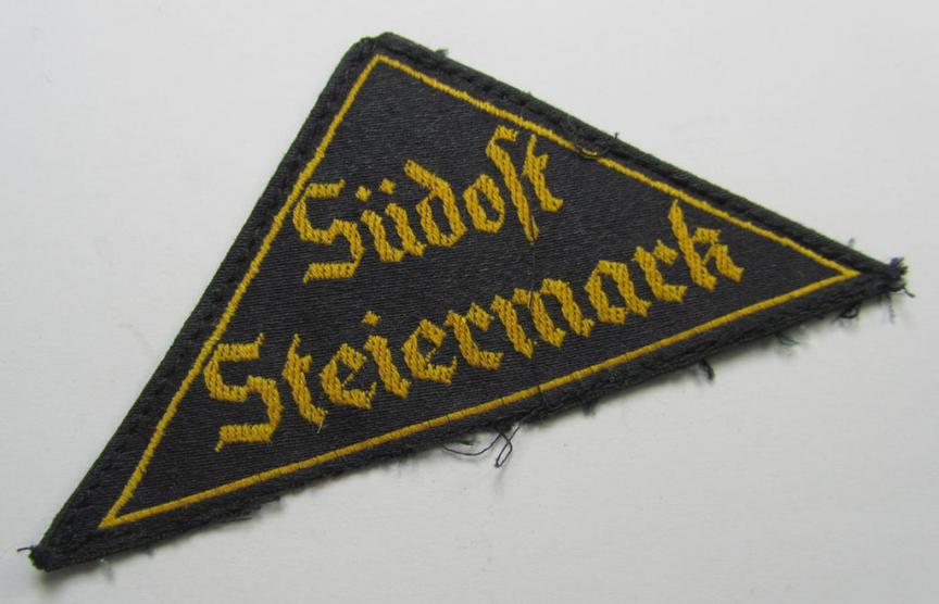 'HJ' ('Hitlerjugend') district-triangle (ie. 'Gebietsdreieck') entitled: 'Südost Steiermark' (being a moderately used- ie. worn  example that shows the remains of its paper-based 'RzM'-etiket on its back)