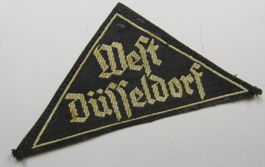 'HJ' ('Hitlerjugend') ie. 'BDM' ('Bund Deutscher Mädel'-) district-triangle (ie. 'Gebietsdreieck') entitled: 'West Düsseldorg' (being a minimally used- and/or worn example that misses its 'RzM'-etiket)