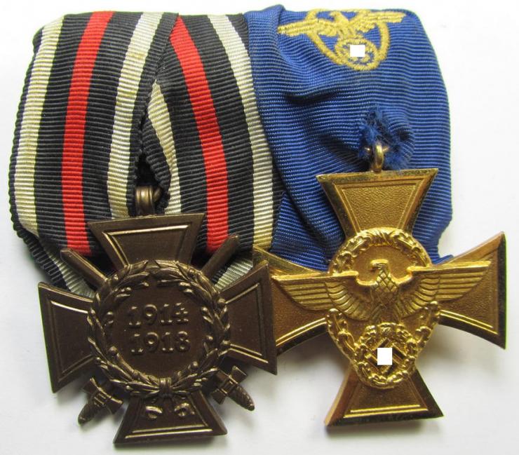 Two-pieced medal-bar (ie. 'Doppelspange') respectively depicting a WWI-period: 'Frontkämpferkreuz 1914-18' (ie.: 'Kriegsteilnehmerkreuz mit Schwerter') and a detailed: 'Polizei-Dienstauszeichnung 1. Stufe'