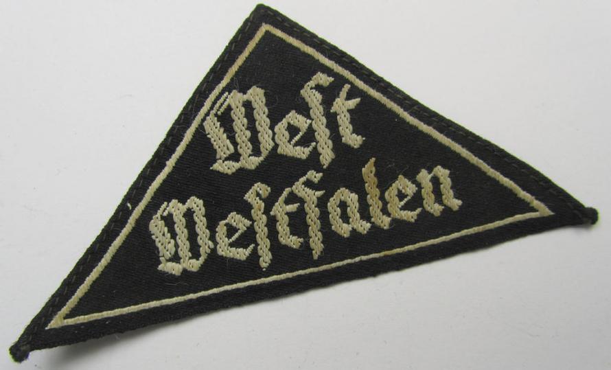 'HJ' ('Hitlerjugend') ie. 'BDM' ('Bund Deutscher Mädel'-) district-triangle (ie. 'Gebietsdreieck') entitled: 'West Westfalen' (being an IMO only moderately used- ie. worn example that misses its paper-based 'RzM'-etiket)