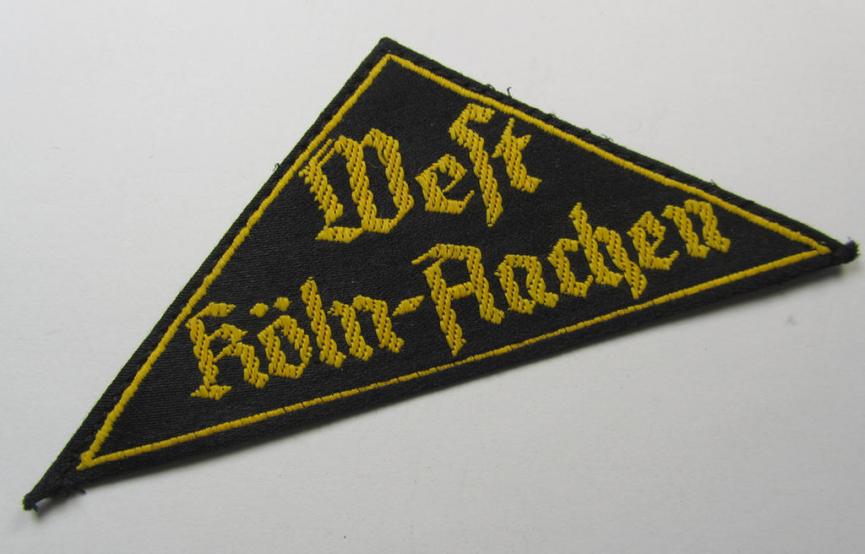 'HJ' ('Hitlerjugend') district-triangle (ie. 'Gebietsdreieck') entitled: 'West Köln-Aachen' (being an IMO never used- nor worn example that regrettably misses its paper-based 'RzM'-etiket)