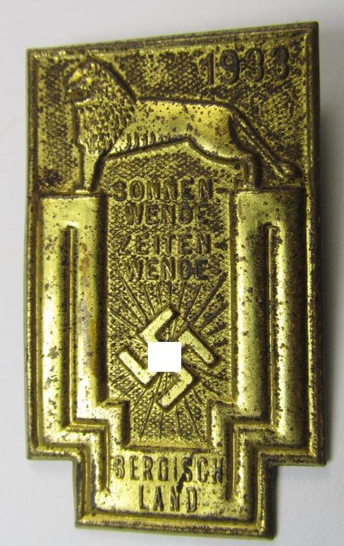 Commemorative, tin-based- and/or: golden-coloured, early-period N.S.D.A.P.-related 'tinnie' being a non-maker marked example depicting a lion and 'swastika'-sunburst-device and bearing the text: 'Sonnenwende Zeitenwende - Bergischland - 1933'