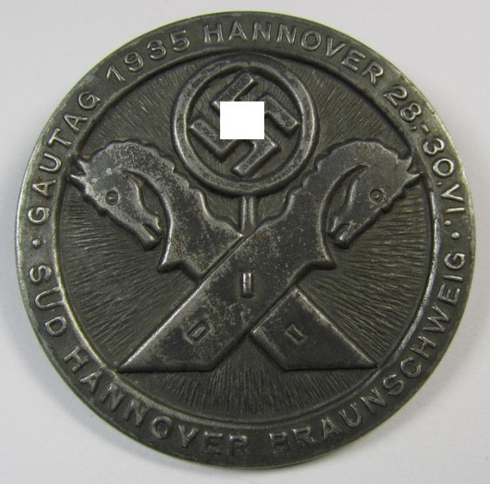 Detailed and pronounced, silverish-black-coloured N.S.D.A.P.-related day-badge (ie. 'tinnie' or: 'Veranstaltungsabzeichen') as was issued to commemorate the: 'Gautag 1935 - Hannover - 28.-30-1935 - Süd-Hannover-Braunschweig'