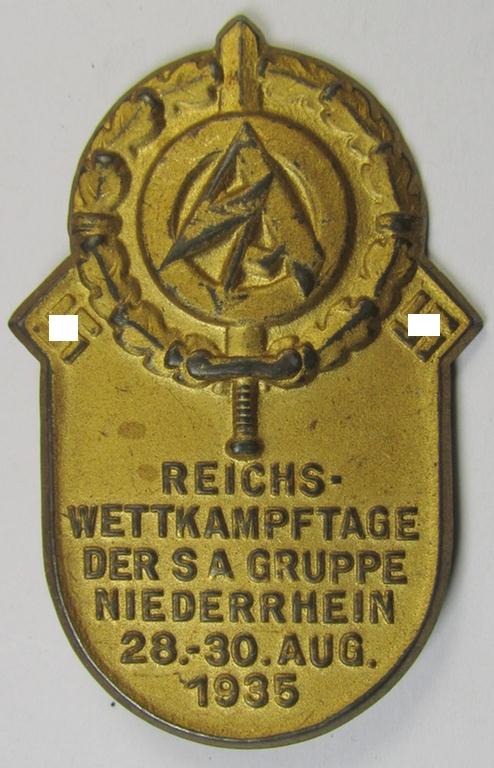 Bright-golden-toned- and/or tin-based SA-related day-badge (ie. 'tinnie' or: 'Veranstaltungsabzeichen') as was issued to commemorate the: 'Reichswettkampftage der SA-Gruppe Niederrhein' held from 28 to 30 August 1935