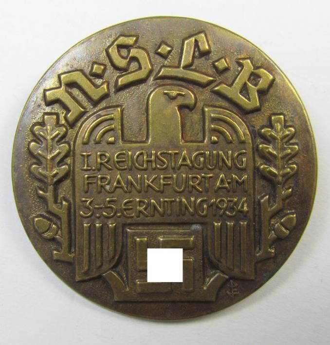 Commemorative, tin-based- and/or: golden-bronze-coloured, early-period N.S.L.B.-related 'tinnie' being a non-maker marked example depicting a 'Reichsadler'-device and bearing the text: '3. Reichstagung - Frankfurt a.M. - 3.-5. Ernting 1934'