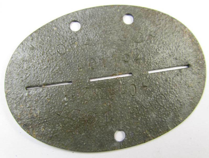 Zinc-based, 'Organisation Todt'-related ID-disc (ie. 'Erkennungsmarke') bearing the clearly stamped designation that reads: 'Org. Todt - 401152'