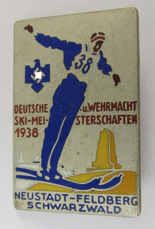 Semi-enamelled- and bright-silver-toned 'N.S.R.L.'-related day-badge (ie. 'tinnie' or: 'Veranstaltungsabzeichen') as was issued to commemorate participation within the: 'Deutsche u. Wehrmacht Ski-meisterschaften 1938'