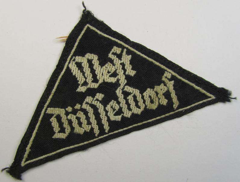 'HJ' ('Hitlerjugend') ie. 'BDM' ('Bund Deutscher Mädel'-) district-triangle (ie. 'Gebietsdreieck') entitled: 'West Düsseldorf' (being a minimally used- and/or worn example that regrettably misses its 'RzM'-etiket)