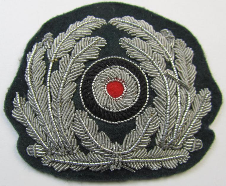 Rarely found WH (Kriegsmarine) officers'-type, hand-embroidered visor-cap-cocarde as was executed in silver-coloured- and/or: 'braid'-based material as was specifically intended for usage on the various, administrative-officers'-type KM-visor-caps