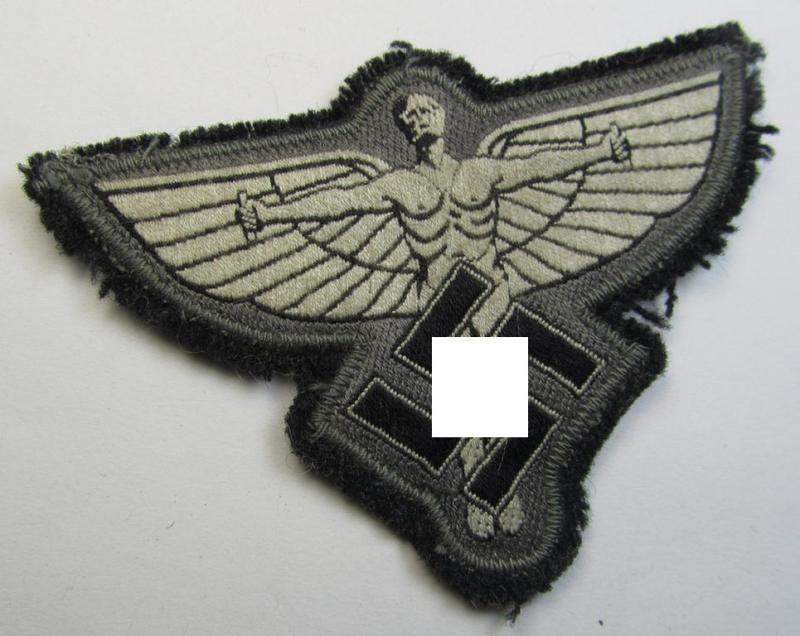 Attractive, bluish-grey-coloured, so-called: N.S.F.K.- (or: 'National Socialistisches Flieger Korps') breast-eagle being a nicely BeVo-woven- (and enlisted-mens'-pattern) example that comes mounted on its piece of bluish-coloured wool
