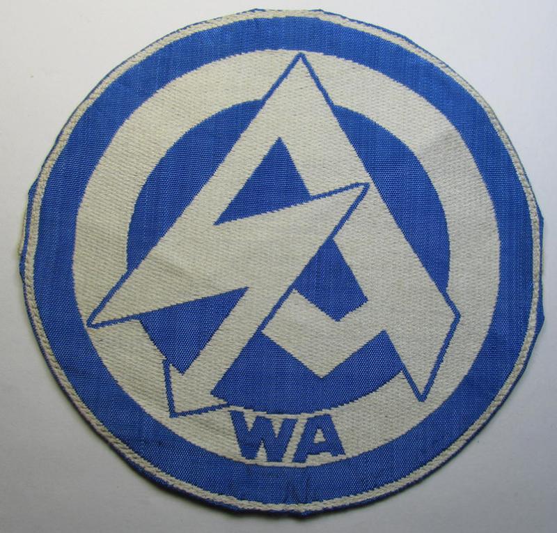 Attractive - and scarcely encountered! - SA (ie. 'Sturmabteilungen'), 'BeVo'-woven sport-shirt insignia still showing its period-attached 'RzM'-etiket as was intended for an SA-member who served within the: 'Gruppe Wartheland' (WA)