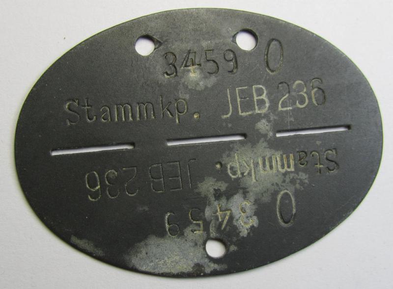 Interesting, zinc-based WH (Heeres) ID-disc (ie. 'Erkennungsmarke') bearing the clearly stamped unit-designation: 'Stammkp. JEB 236' and that comes as issued and/or worn