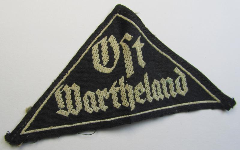 Stunning - and extremely rarely encountered! - HJ ('Hitlerjugend') ie. BDM (or: 'Bund Deutscher Mädel') district-triangle (ie. 'Gebietsdreieck') entitled: 'Ost Wartheland'