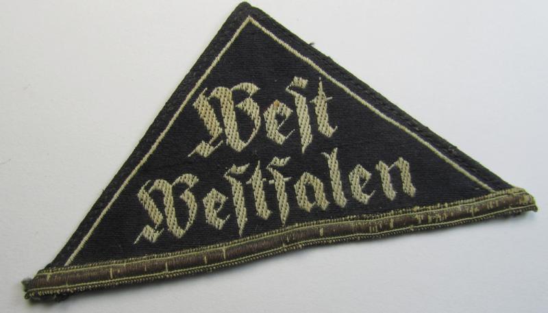 HJ- ie. BDM (ie. 'Hitlerjugend' or: 'Bund Deutscher Mädel') district-triangle (ie. 'Gebietsdreieck') entitled: 'West Westfalen' (showing a period-attached, silver-toned 'honorary rank-stripe' signifying BDM-membership before 1933)