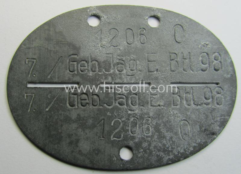 Superb - and truly scarcely found! - typical zinc-based, WH (Heeres-) ie. 'Gebirgsjäger'-related ID-disc (ie. 'Erkennungsmarke') bearing the clearly stamped unit-designation that reads: '7./Geb.Jäg.E.Btl. 98' and that comes as issued and found