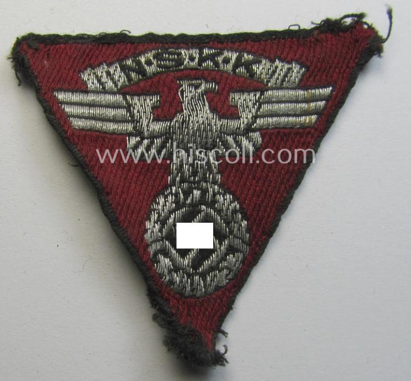 Attractive - and truly used! - so-called: N.S.K.K. (ie. 'National Socialistisches Kraftfahr Korps') side-cap-eagle (ie. 'Adler für Schiffchenmütze') being a 'flat-wire-woven'-example that comes mounted onto a wine-red-coloured background