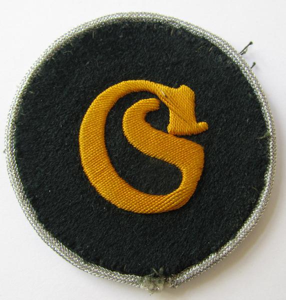 WH (Heeres) so-called: trade- and/or special-career arm-insignia (ie. 'Laufbahn- o. Tätigkeitsabzeichen') as intended for a: 'Geprüfter Schirrmeister' (being a neatly hand-embroidered variant as mounted onto a darker-green woolen background)