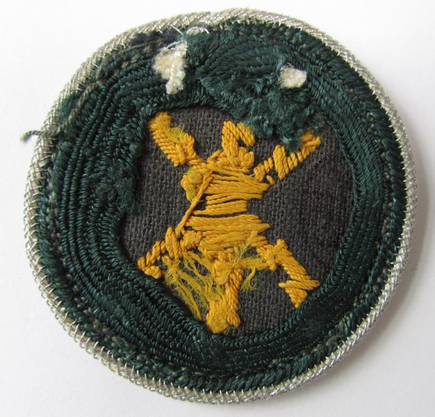 Nice, WH (Heer) so-called trade- and/or special career arm-insignia as intended for a: 'Geprüfter Funkmeister', being a hand-embroidered variant on dark-green wool - very nice, slightly used ie. worn condition! 
