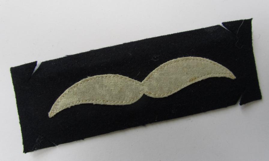 Nice - and scarcely encountered, albeit regrettably single - WH (Luftwaffe), dark-blue coloured and/or woolen-based, NCO-type rank-patch (aka 'moustache'), as intended for an: 'Unteroffizier' - very nice (IMO virtually mint-/unissued!) condition!