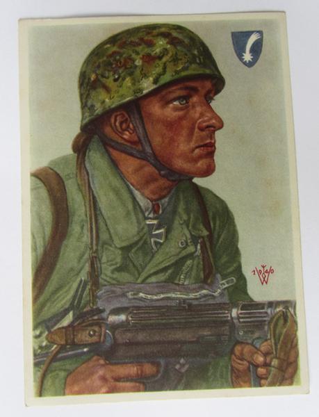 Nice and semi-colourfull so-called: 'Willrich'-type period picture-postcard, depicting the 'FJ (ie. Fallschirmjäger) 'Feldwebel' Arpke - overall nice ie. virtually mint, unissued condition!