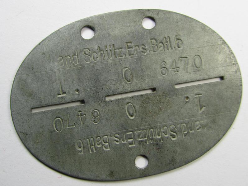 Neat, 'Feinzink'-based WH (Heeres) ID-disc (ie. 'Erkennungsmarke') bearing the clearly stamped unit-designation: '1. Land.Schütz.Ers.Batl. 6' (being a disc as intended for a soldier that served within the: 'Landesschützen-Ersatz-Battailon 6')