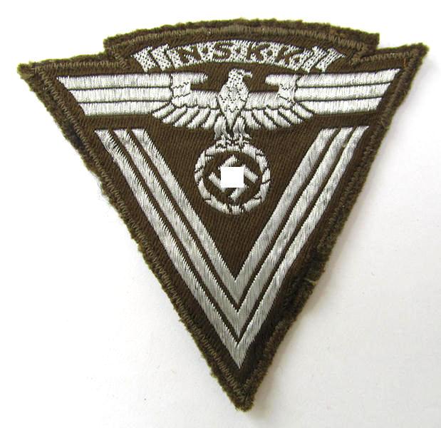 Very nice - and actually scarcely encountered! - N.S.K.K. (ie. 'National Socialistisches Kraftfahr Korps') so-called: 'N.S.K.K.-Ärmelabzeichen' showing a combined arm-eagle and/or chevron - overall very nice condition!