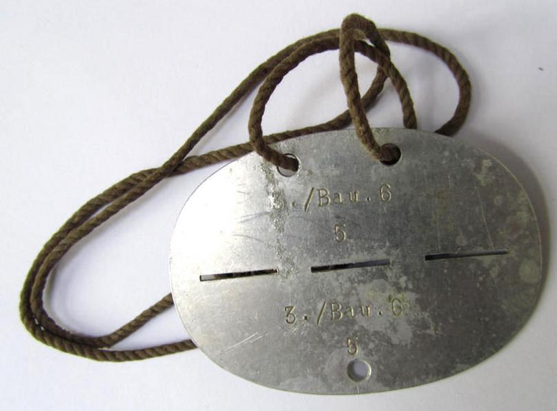 Neat, aluminium-based, WH (Luftwaffe or Heeres) 'Pioniere'-/'Bau' (ie. engineers-) related ID-disc, bearing a stamped unit-inscription- ie. designation that reads: '3./Bau.6' - nice, albeit clearly used ie. worn-, condition!