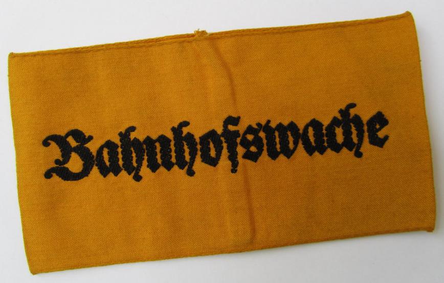 Very nice - and rarely encountered! - Wehrmacht-related, golden-yellow-coloured and/or linnen-based  armband entitled: 'Bahnhofswache' (or railway-station guard) - overall very nice (ie. moderately used-) condition!
