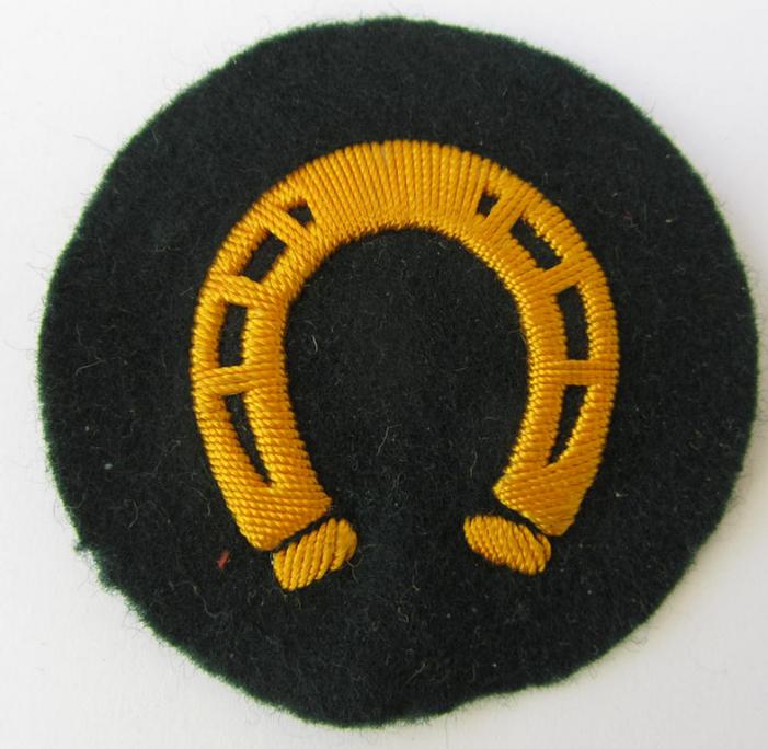 Nice, WH (Heeres) so-called trade- and/or special career arm-patch as intended for a: 'Hufbeschlagmeister' (or farrier), being a nicely hand-embroidered variant on darker-green-coloured wool - overall nice condition!