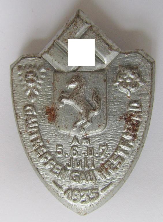 Commemorative, silver-coloured N.S.D.A.P.-related day-badge (ie. 'Veranstaltungsabzeichen' or: 'tinnie') being a non-maker-marked example depicting a provincial-armshield surrounded by the text: 'Gautreffen Gau Westf. Nord - 5.6.u.7. Juli 1935'