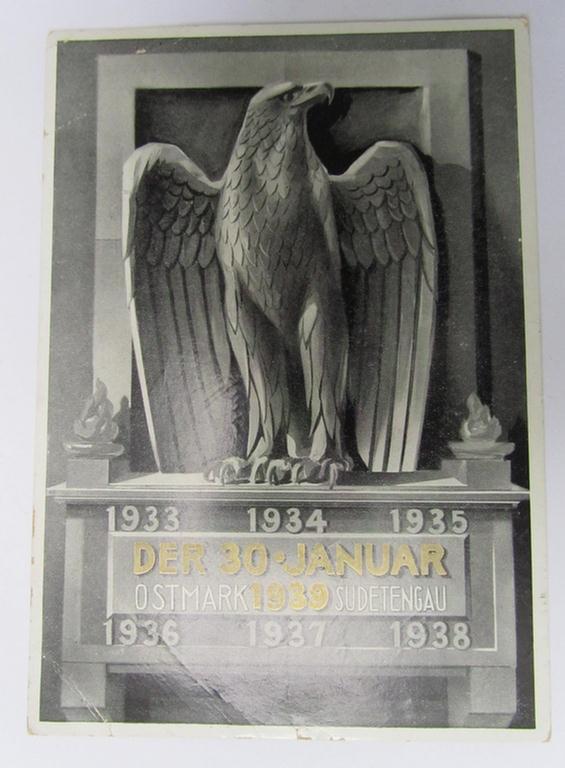 Attractive, semi-colourfull ie. N.S.D.A.P.-related-, commemorative period- postcard entitled: 'Der 30. Januar 1939 - Ostmark - Sudetengau' (ie. 'Gedenkkarte zum Gründungstag des Dritten Reiches') showing a special ink-stamping on the back 