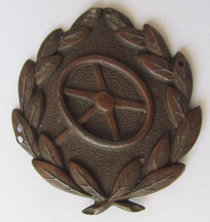 WH (Heeres- ie. Waffen-SS or Luftwaffe) so-called: 'Kraftfahrbewährungs-Abzeichen in Bronze' (or drivers' proficiency-badge in bronze), being a damaged example that was worn as a badge of the 'sew-on'-type