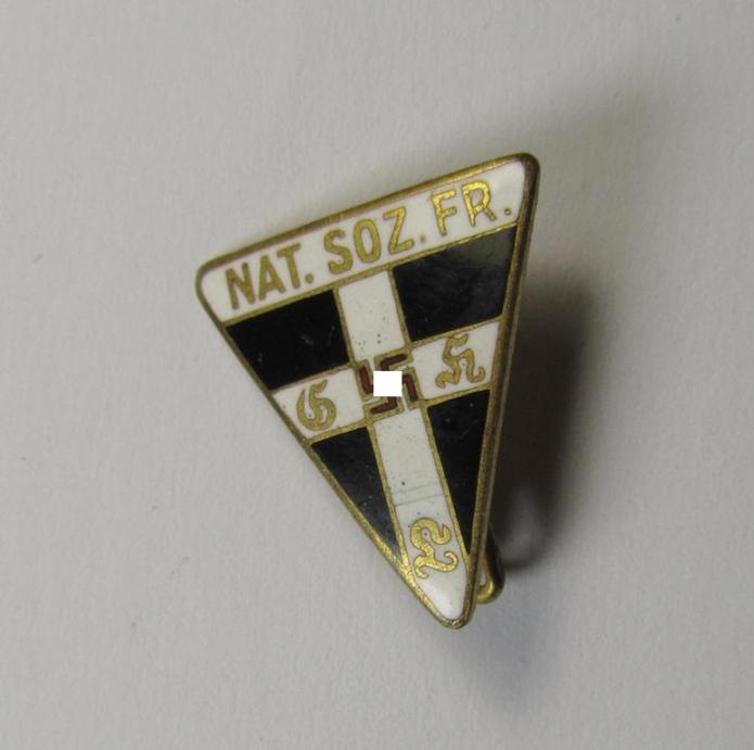 Attractive miniature, enamelled, 'NS-Frauenschaft'-membership-badge (ie. 'Mitgliedsabzeichen'), being a 20 mm. sized example of the fourth pattern that is neatly marked with the signification: 'RzM - 63' on its back