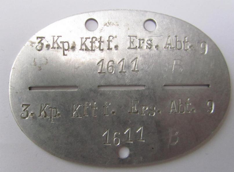 Attractive, aluminium-based, WH (Heeres) ie. 'Nachshub'-related- ID-disc, bearing the stamped unit-designation: '3.Kp.Kftf.Ers.Abt. 9', in overall nice (albeit clearly used ie. worn-) condition