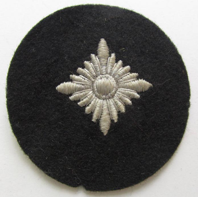 Waffen-SS- (ie. Heeres-'Panzer'-) type, machine-embroidered rank-badge (or: roundel) as executed on smooth-type & black-coloured wool, as intended for an: 'SS-Oberschütze' (ie. Heeres 'Oberschütze')