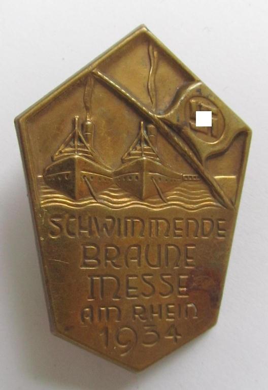 Commemorative - copper-based- and/or copper-coloured - N.S.D.A.P.-related 'tinnie', being a non-maker marked example, depicting a raised swastika-flag and two ships with below the text: 'Schwimmende Braune Messe am Rhein 1934' 