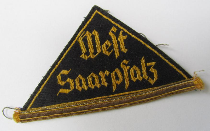 Neat - and truly rarely encountered! - HJ/BDM ('Hitlerjugend'/'Bund Deutscher Mädel') district-triangle entitled: 'West Saarpfaltz', having a period-attached, golden-toned 'honorary rank-stripe', signifying HJ-membership before 1933