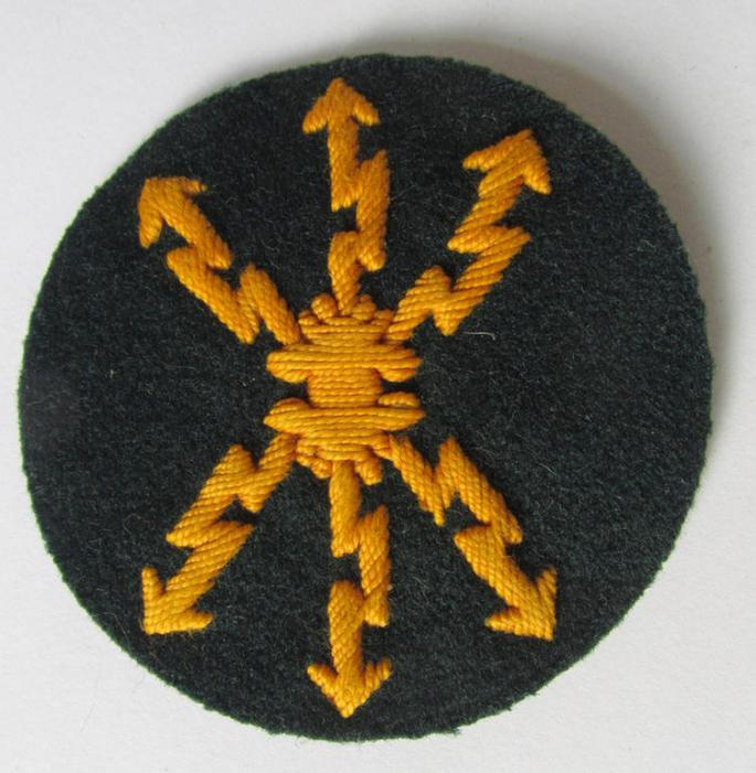 Attractive, WH (Heeres) so-called: trade- and/or special career arm-insignia, as was intended for a: 'Funkmeister', being a neatly hand-embroidered variant on darker-green-coloured wool