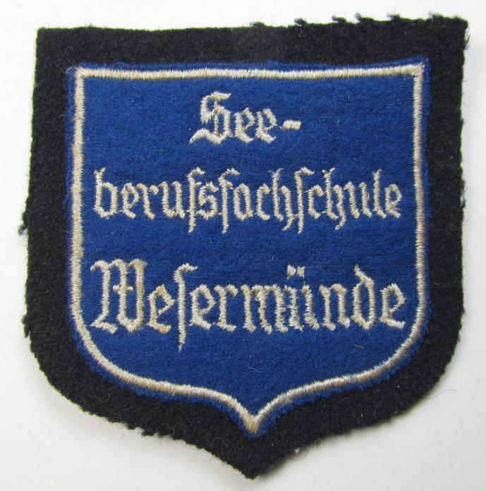 Superb - and with certainty very rarely encountered! - Marine-HJ (ie. 'Marine-Hitlerjugend') arm-badge (aka: 'Ärmelabzeichen') depicting the embroidered text: 'Seeberufsfachschule Wesermünde'