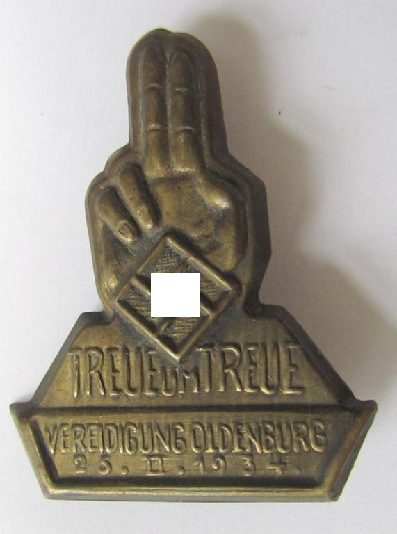 Commemorative - copper-based-, N.S.D.A.P.-related 'tinnie', being a non-maker-marked example depicting an upright hand (with swastika) with below the text: 'Treue für Treue - Vereidigung Oldenburg - 25-II-1934'