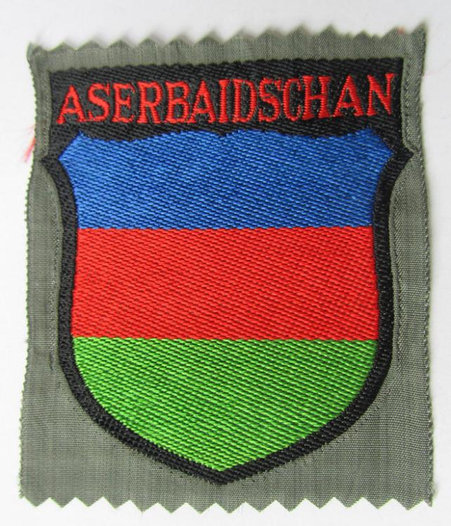 Neat, 'BeVo'-type armshield entitled: 'Aserbaidschan', being a piece as intended for a volunteer who served within the 'Deutsche Wehrmacht' ie. within the 'Aserbaidschanisches Legion'