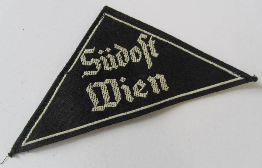 Attractive, 'HJ' ('Hitlerjugend') ie. 'BDM' (or: 'Bund Deutscher Mädel') district-triangle (ie. 'Gebietsdreieck') entitled: 'Südost Wien', that comes with its originally attached, paper-based 'RzM'-etiket