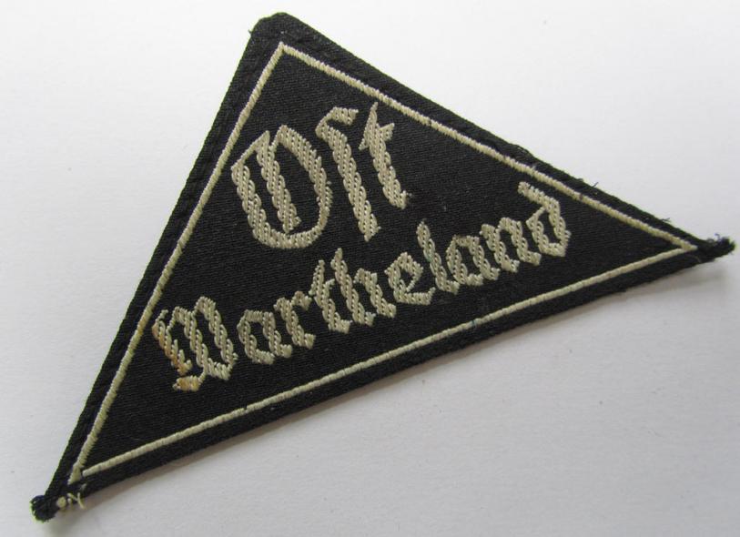 Superb - and actually extremely rarely encountered! - 'HJ' ('Hitlerjugend') ie. 'BDM' (or: 'Bund Deutscher Mädel') district-triangle (ie. 'Gebietsdreieck') entitled: 'Ost Wartheland'