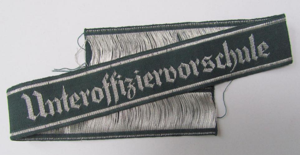 Attractive example of an - actually scarcely encountered! - WH (Heeres) linnen-based-, cuff-title (ie. 'Ärmelstreifen') entitled: 'Unteroffiziervorschule', as was executed in so-called: 'flat-wire'-style (ie. 'BeVo-weave'-pattern)
