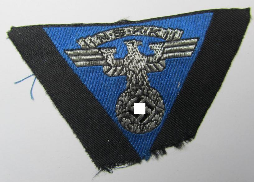 Attractive, so-called: N.S.K.K. (ie. 'National Socialistisches Kraftfahr Korps') side-cap-eagle (ie. 'Adler für Schiffchen'), being a 'flat-wire-woven'-example that comes on a cornflower-blue-coloured background